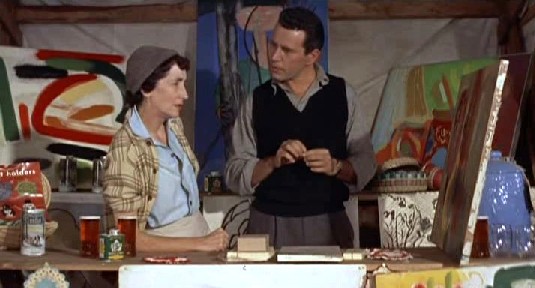 Marlowe meets Mrs Wiggs to check about his paintings