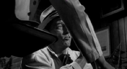 A frame from Cape Fear: a waiter's arm, and Robert Mitchum A frame from Cape Fear: a waiter's arm, and Robert Mitchum
