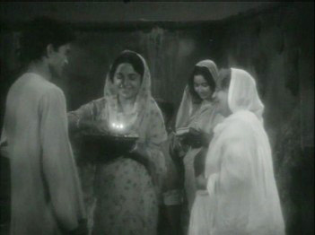 A young man is sent off by his womenfolk A young man is sent off by his womenfolk