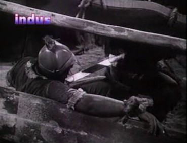 Sherwa grabs a sleeping Mongol's sword - with his teeth