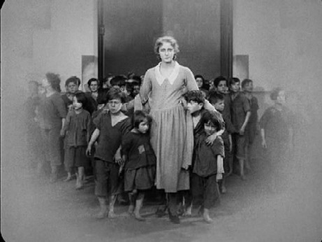 Maria brings some workers' children to the Eternal Gardens