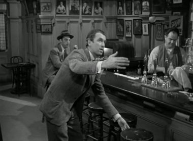 Elwood ushers Harvey to a bar counter