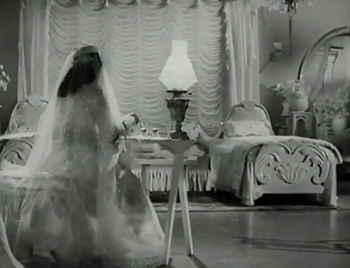 P sits at her desk, all dressed up