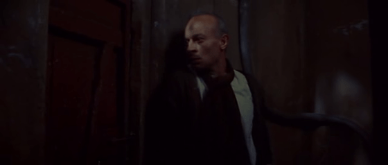 A Pole sees someone through a crack in a door