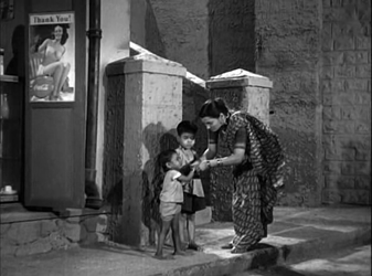 Kamla teaches the children to beg