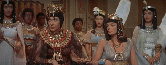 The queen and the princess look on