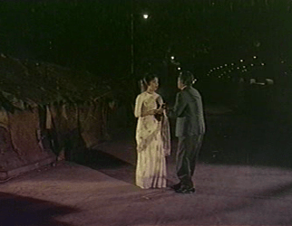 The smuggler hands over the postcards to a stranger