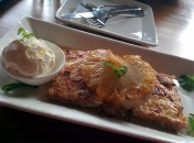 Coconut French toast, served with caramelised pineapple and vanilla ice cream.