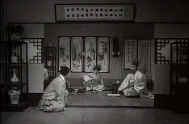 A servant reports the coming of a guest