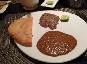 Dinner at Kebab Theater: taaftaan, haleem, and daal-e-balai.