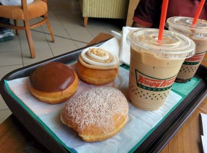 Krispy Kreme: a selection of doughnuts and coffee.