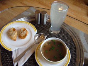 From room service: a fresh lime soda and a won ton vegetable soup, both good.