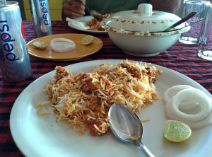 Biryani, sliced onions and lime at Pista House.