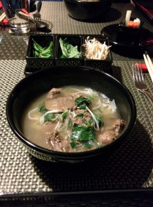 Pho at Republic of Noodles. A tray of garnishes - sprouts, basil and mint - sits in the background.