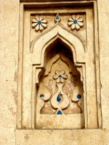 An example of tile work and incised plaster, at Jamaali-Kamaali.