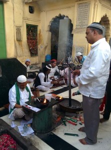 At the dargah, a small group of qawwals beside the tomb of Zia'uddin Barani.