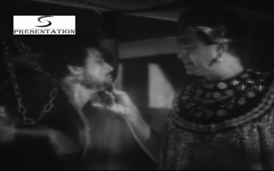 Kaikavoos, in chains.