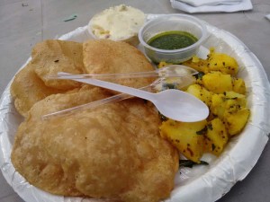 Shrikhand-puri, with potato sabzi and green chutney.