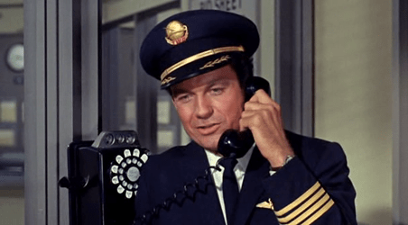 Adam phones Mona from the airport