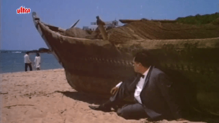 An onlooker watches Liz and Ajay