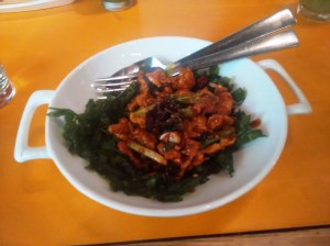 Stir-fried chicken with star anise, served with crisp spinach.