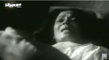 Kishan's mother, on her deathbed