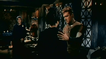 Livius tries to explain to Lucilla while Timonides looks on