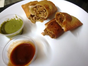 Hand pies: chicken in oyster sauce, and pulled pork in BBQ sauce - served with two sauces.