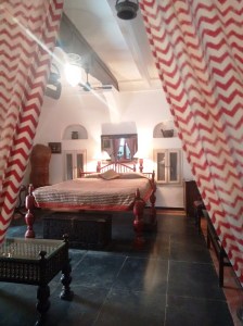 Inside Malabar Mahal: the height of that bed is impressive!