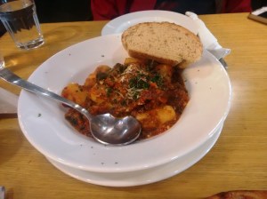 Gnocchi with roasted pepper sauce.