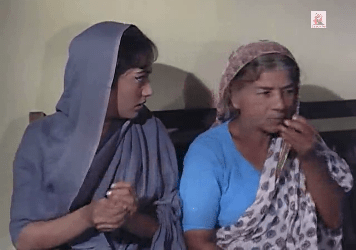 An old woman brings instructions, presumably