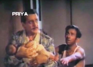 Ranjit takes the baby from D;Souza