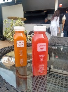 Two types of cold-pressed juices; orange, and melony.