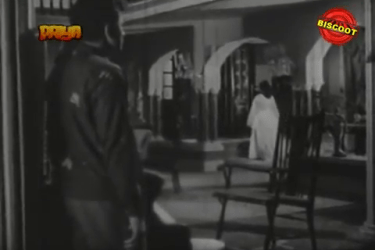 The woman in white, with Prakash in tow