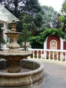 A couple of fountains and pretty stone benches, outside The Kumaon Room.