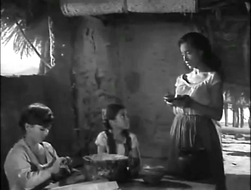 Macario's wife lights a lamp for her dead mother-in-law