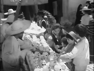 The children look at the stalls with confectionery