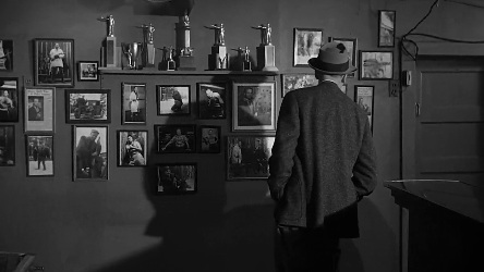 Biegler examines the trophies on the bar wall