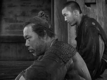 The woodcutter and the priest shelter in the Rashomon gatehouse