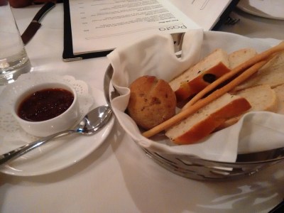 Bread basket and an olive spread.
