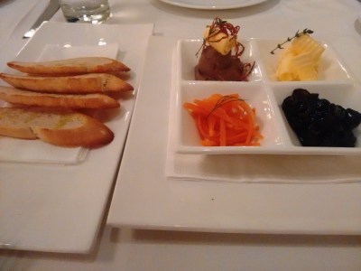 Chicken liver pate with toast, pickled carrots, and caramelized onions.