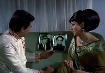 ... and fall in love, enough for Asha to show him Daddy's and Chachaji's photos