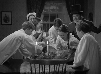 At the Cratchitt's home, the family greets their upcoming feast with glee