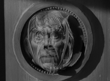 The door knocker turns into Marley's face