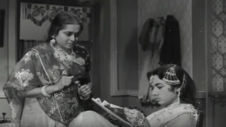 Mausi sees Lakshmi reading