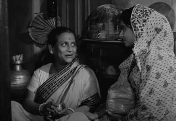 Bhombol's mother, pleased with a gift